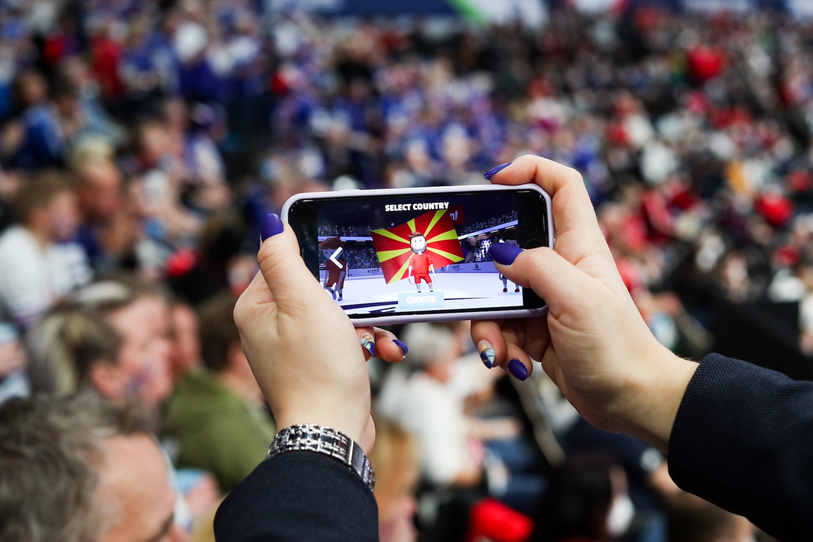 Fan playing a mobile handball game