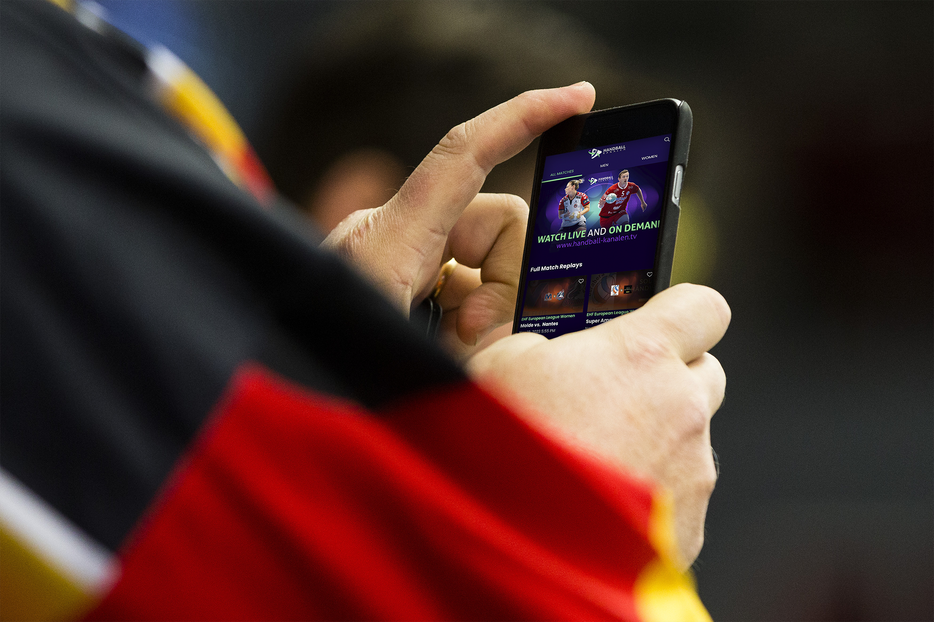 Fan watching a streaming channel on his phone
